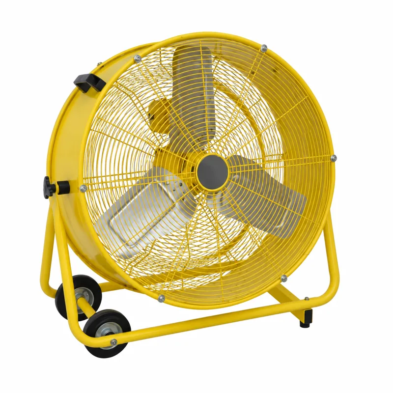Ventilador amarillo de tambor con rejilla circular, estructura de apoyo y ruedas.